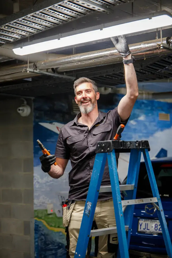 Kieran, founder of LED Solutions, installing an LED batten