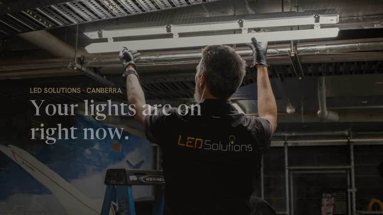 LED Solutions electrician installing a batten in a commercial carpark